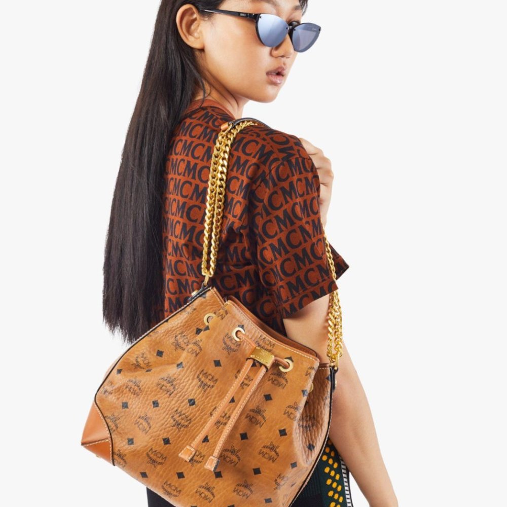 MCM DRAWSTRING BAG ( NWOT)